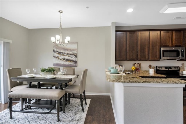 613 Freeman Dr, Hampton, VA 23666 - dining area featuring a chandelier, wood finished floors, baseboards, and recessed lighting