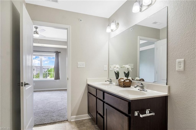 613 Freeman Dr, Hampton, VA 23666 - full bath with double vanity, baseboards, a textured wall, and ceiling fan