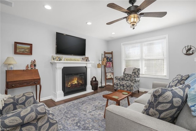 28111 Harbor Rd, Melfa, VA 23410 - living area featuring a ceiling fan, wood finished floors, a glass covered fireplace, recessed lighting, and baseboards