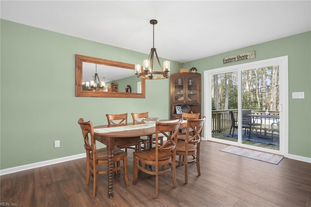28111 Harbor Rd, Melfa, VA 23410 - dining area featuring a chandelier, wood finished floors, and baseboards