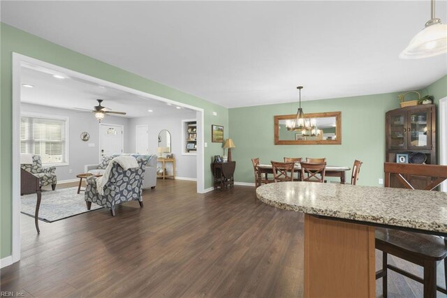 28111 Harbor Rd, Melfa, VA 23410 - dining area with dark wood finished floors, a chandelier, baseboards, recessed lighting, and a ceiling fan