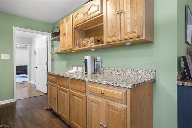 28111 Harbor Rd, Melfa, VA 23410 - kitchen featuring light stone counters, open shelves, dark wood-type flooring, and baseboards