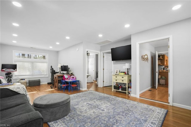 28111 Harbor Rd, Melfa, VA 23410 - living room featuring wood finished floors, baseboards, recessed lighting, and an office area