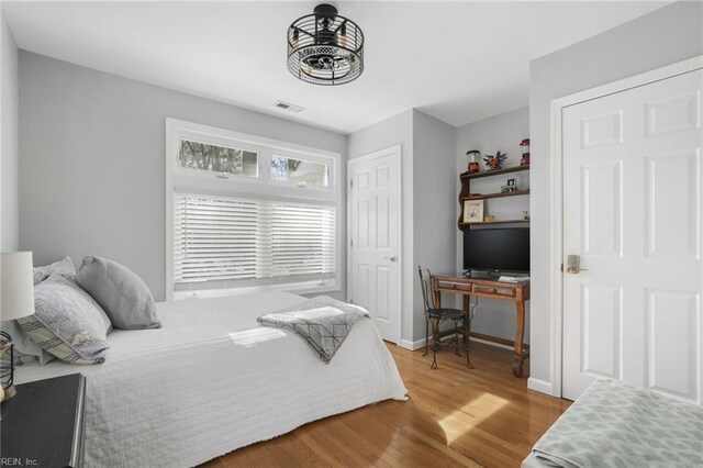28111 Harbor Rd, Melfa, VA 23410 - bedroom with wood finished floors and an office area