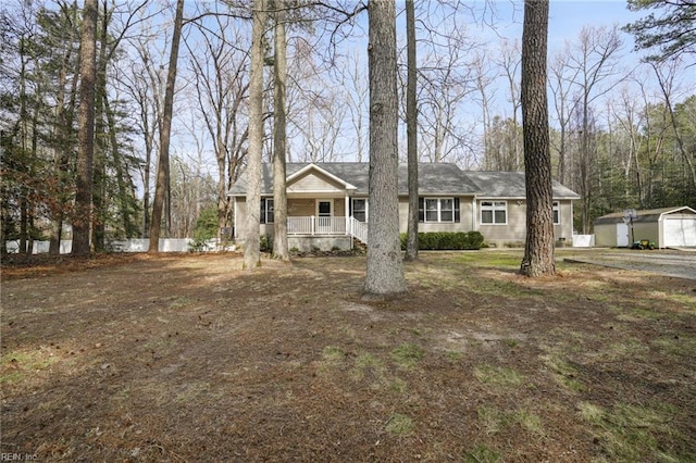 28111 Harbor Rd, Melfa, VA 23410 - ranch-style house with a porch and an outdoor structure