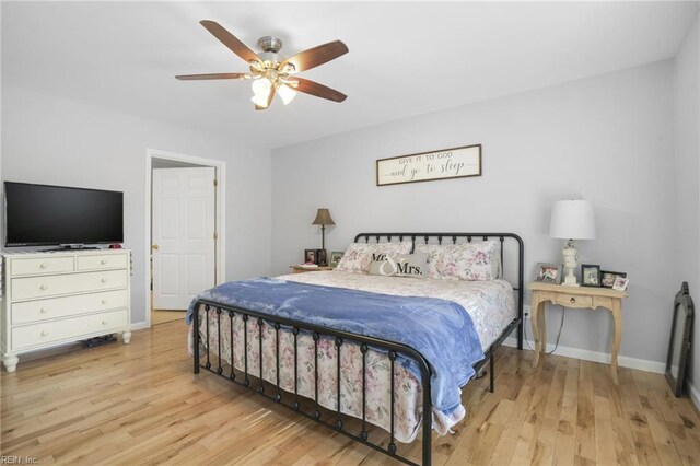 28111 Harbor Rd, Melfa, VA 23410 - bedroom featuring wood finished floors, baseboards, and a ceiling fan