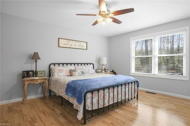 28111 Harbor Rd, Melfa, VA 23410 - bedroom featuring baseboards, wood finished floors, and ceiling fan