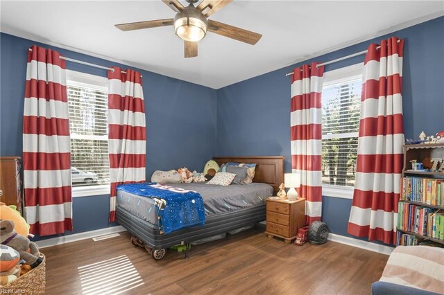28111 Harbor Rd, Melfa, VA 23410 - bedroom with multiple windows, baseboards, and wood finished floors