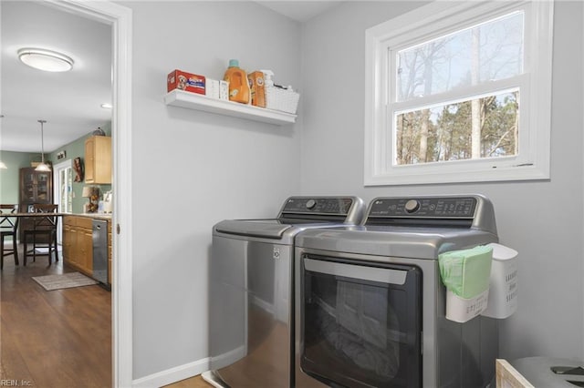 28111 Harbor Rd, Melfa, VA 23410 - laundry room featuring washer and clothes dryer, wood finished floors, and baseboards