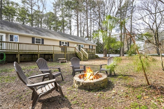28111 Harbor Rd, Melfa, VA 23410 - view of yard with a fire pit, a wooden deck, and stairway