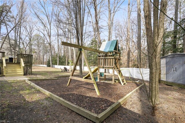 28111 Harbor Rd, Melfa, VA 23410 - view of jungle gym featuring fence, a wooden deck, and view of scattered trees