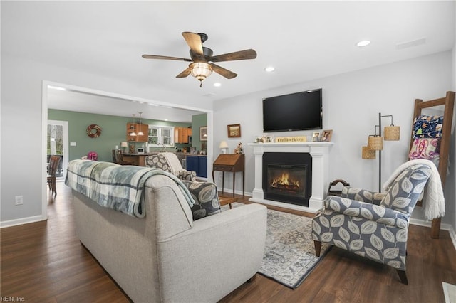 28111 Harbor Rd, Melfa, VA 23410 - living area with ceiling fan, dark wood finished floors, recessed lighting, a glass covered fireplace, and baseboards