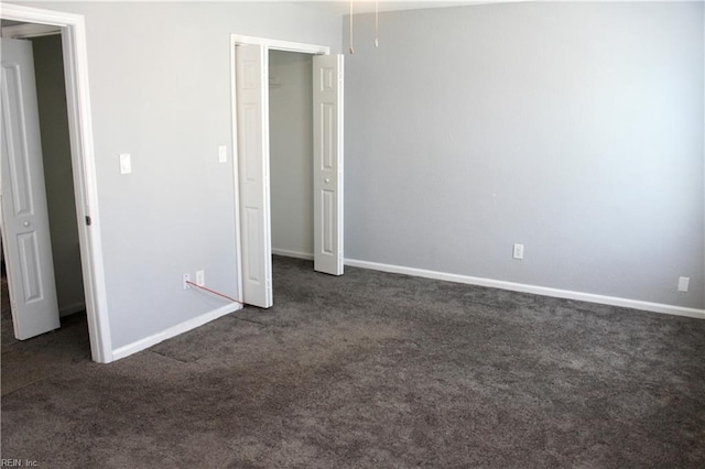 1307 Hibie St, Norfolk, VA 23523 - unfurnished bedroom with dark colored carpet and baseboards