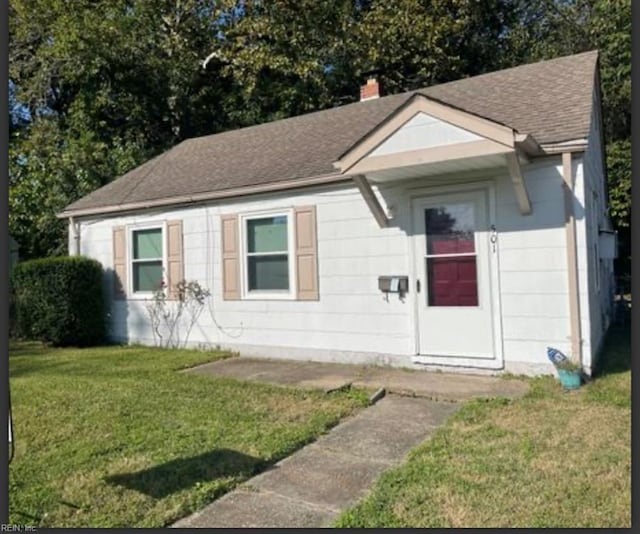 501 Astor Cir, Norfolk, VA 23505 - ranch-style home with roof with shingles, a front yard, and a chimney