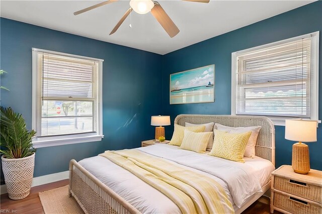 8284 Fernwood Dr, Norfolk, VA 23518 - bedroom with multiple windows, wood finished floors, baseboards, and a ceiling fan