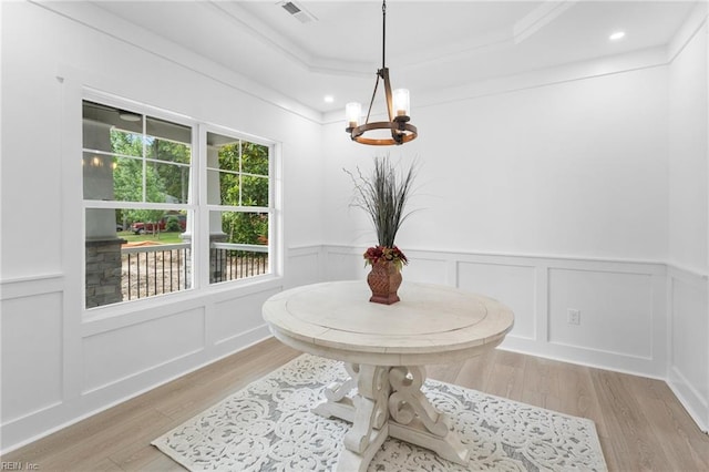 107 Wheeley Cir, Yorktown, VA 23693 - dining space with light wood-style floors, a chandelier, a decorative wall, a raised ceiling, and recessed lighting