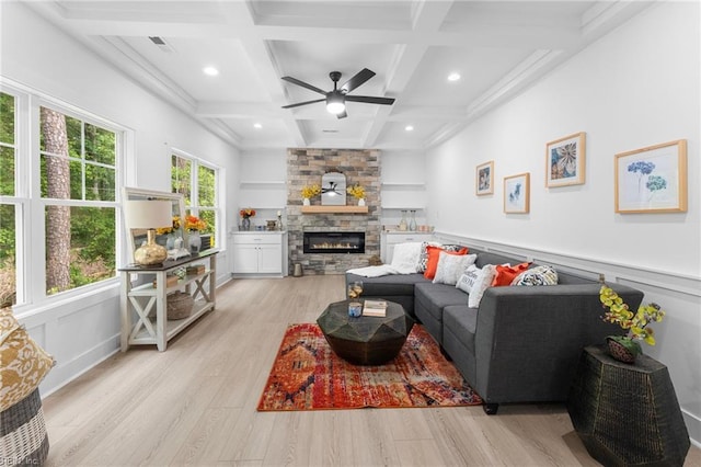 107 Wheeley Cir, Yorktown, VA 23693 - living room featuring light wood finished floors, coffered ceiling, a stone fireplace, ceiling fan, and beamed ceiling
