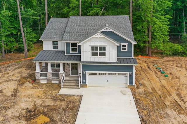 107 Wheeley Cir, Yorktown, VA 23693 - view of front of property featuring board and batten siding, a porch, an attached garage, and a shingled roof