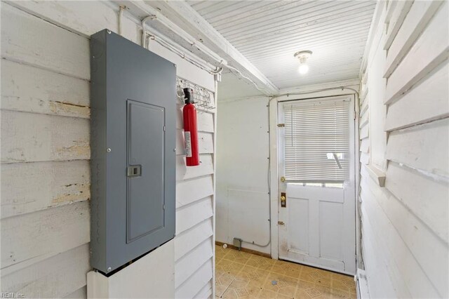 doorway to outside with electric panel