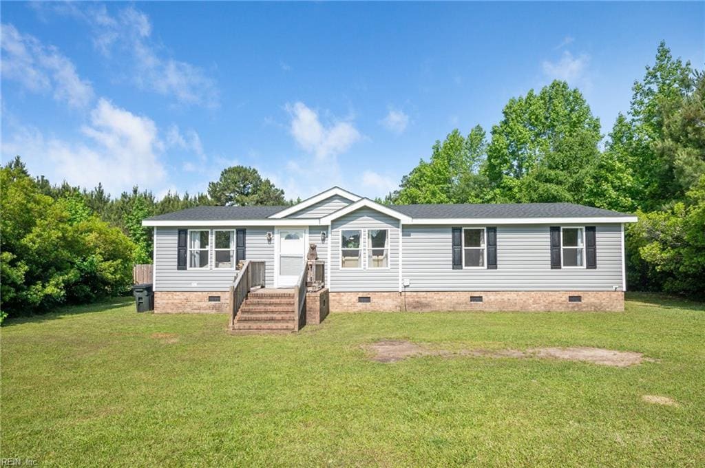 617 Acorn Hill Rd, Sunbury, NC 27979 - manufactured / mobile home featuring crawl space, a front lawn, and a shingled roof