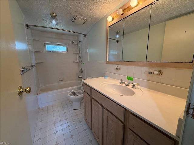 1224 Old Clubhouse Rd, Virginia Beach, VA 23453 - bathroom with a textured ceiling, toilet, washtub / shower combination, vanity, and tile walls