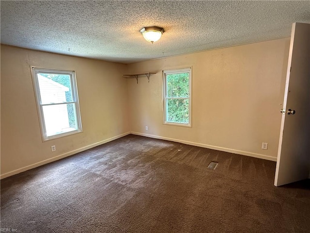 1224 Old Clubhouse Rd, Virginia Beach, VA 23453 - empty room featuring a textured ceiling, dark colored carpet, and baseboards
