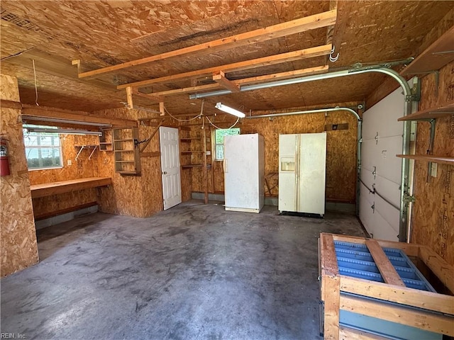 1224 Old Clubhouse Rd, Virginia Beach, VA 23453 - garage with freestanding refrigerator and white fridge with ice dispenser