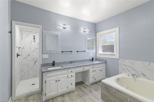 1250 27th St, Newport News, VA 23607 - bathroom featuring a bath, double vanity, and a marble finish shower