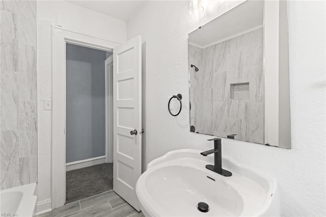 1250 27th St, Newport News, VA 23607 - full bathroom with a sink and wood tiled floors