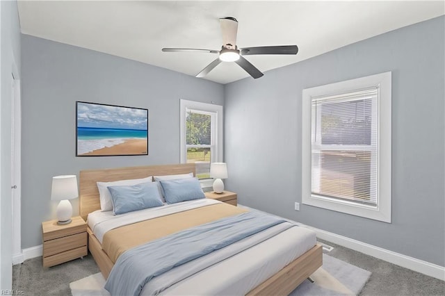 1250 27th St, Newport News, VA 23607 - carpeted bedroom with baseboards and a ceiling fan