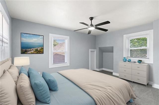 1250 27th St, Newport News, VA 23607 - bedroom with light carpet, ceiling fan, and baseboards