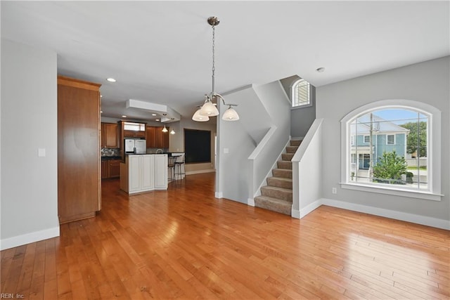 9628 7th Bay St Unit A, Norfolk, VA 23518 - unfurnished living room featuring baseboards, light wood-type flooring, stairs, and recessed lighting