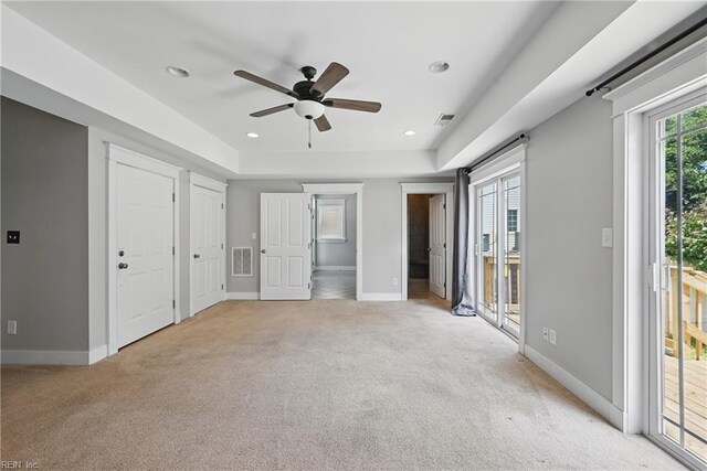 9628 7th Bay St Unit A, Norfolk, VA 23518 - unfurnished bedroom featuring light colored carpet, access to exterior, baseboards, a tray ceiling, and recessed lighting
