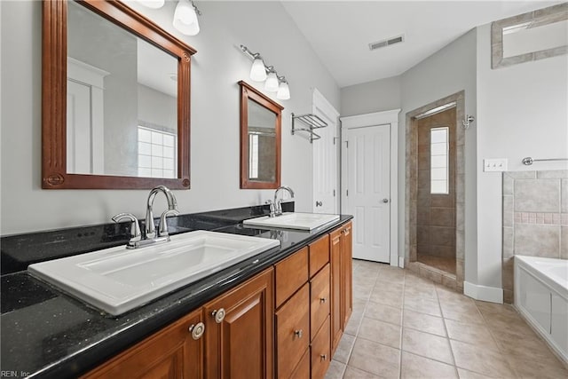 9628 7th Bay St Unit A, Norfolk, VA 23518 - bathroom featuring tile patterned flooring, a garden tub, double vanity, and tiled shower