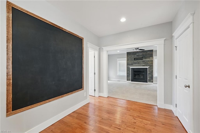 9628 7th Bay St Unit A, Norfolk, VA 23518 - unfurnished living room featuring a large fireplace, light wood-style flooring, baseboards, recessed lighting, and ceiling fan