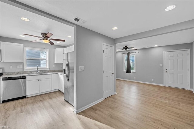 2728 Sewells Point Rd, Norfolk, VA 23513 - kitchen featuring stainless steel appliances, a sink, a ceiling fan, white cabinets, and recessed lighting
