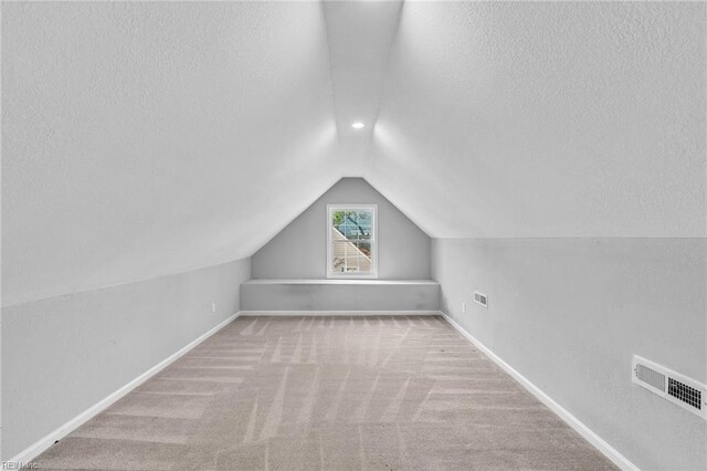 2728 Sewells Point Rd, Norfolk, VA 23513 - bonus room with vaulted ceiling, a textured ceiling, baseboards, and carpet floors