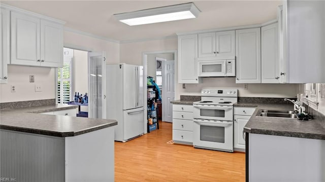 7371 Kirby Cres, Norfolk, VA 23505 - kitchen featuring white appliances, a sink, dark countertops, light wood finished floors, and white cabinets