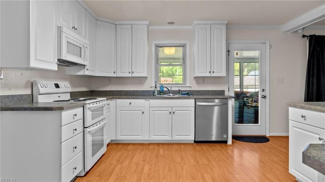 7371 Kirby Cres, Norfolk, VA 23505 - kitchen with white appliances, healthy amount of natural light, a sink, white cabinetry, and crown molding