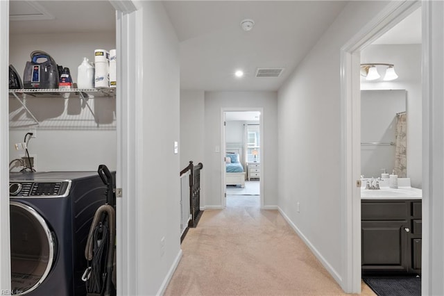 705 Mapleleaf Ln, Virginia Beach, VA 23462 - laundry room with washer / dryer, light carpet, and baseboards