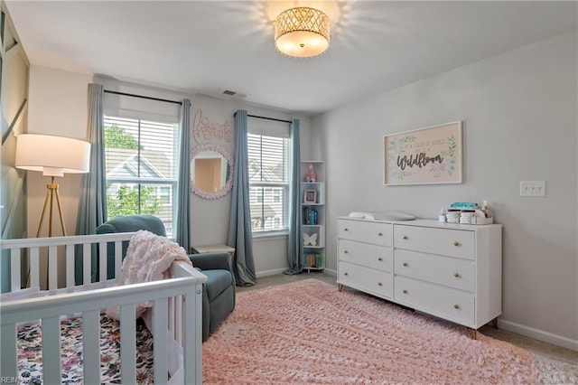 705 Mapleleaf Ln, Virginia Beach, VA 23462 - bedroom with light colored carpet, multiple windows, and baseboards