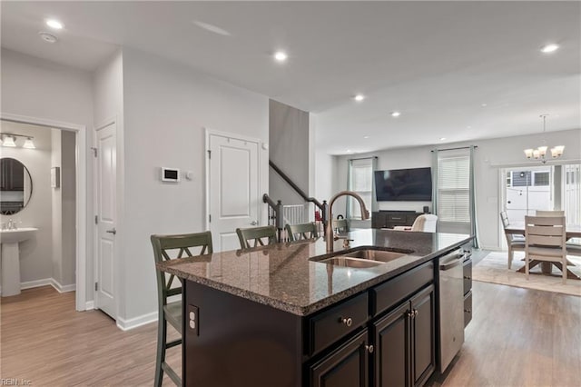705 Mapleleaf Ln, Virginia Beach, VA 23462 - kitchen featuring a sink, a kitchen bar, stainless steel dishwasher, light wood-type flooring, and a chandelier