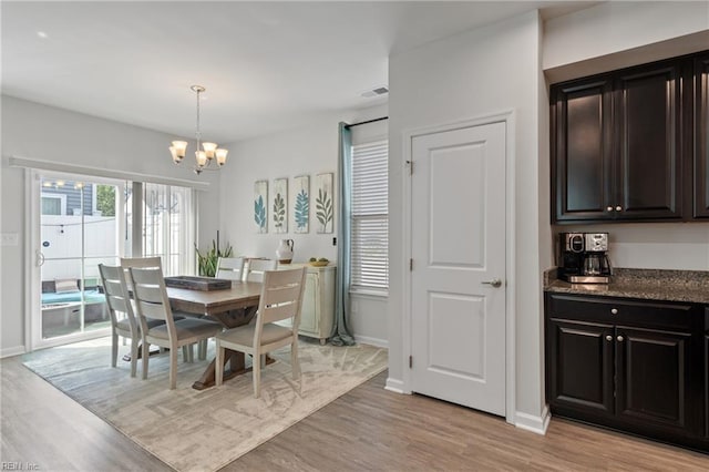 705 Mapleleaf Ln, Virginia Beach, VA 23462 - dining area with a chandelier, light wood-style flooring, and baseboards
