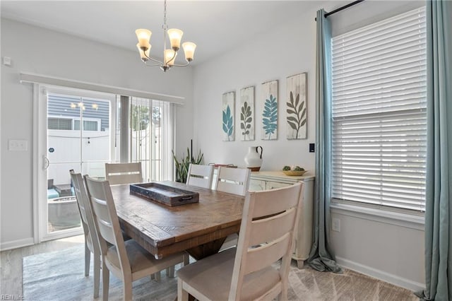 705 Mapleleaf Ln, Virginia Beach, VA 23462 - dining area featuring a chandelier, baseboards, and light wood-style flooring