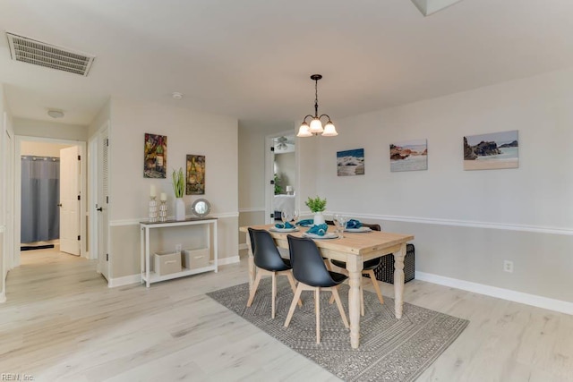 3914 Van Ness Dr, Virginia Beach, VA 23462 - dining area featuring light wood finished floors, baseboards, and a chandelier