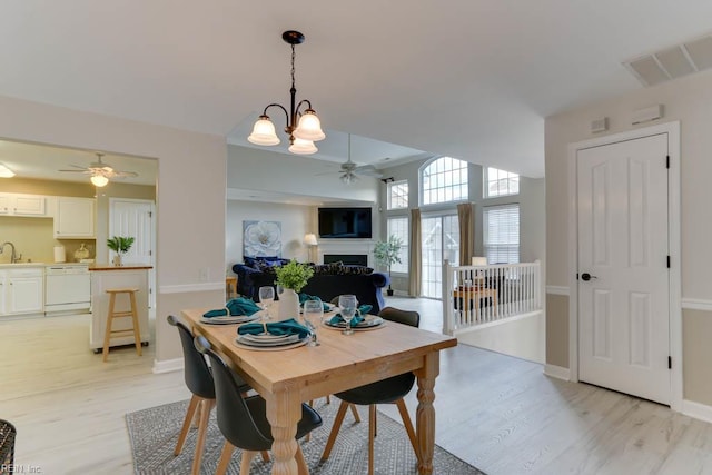 3914 Van Ness Dr, Virginia Beach, VA 23462 - dining space with ceiling fan, light wood-type flooring, a fireplace, and baseboards