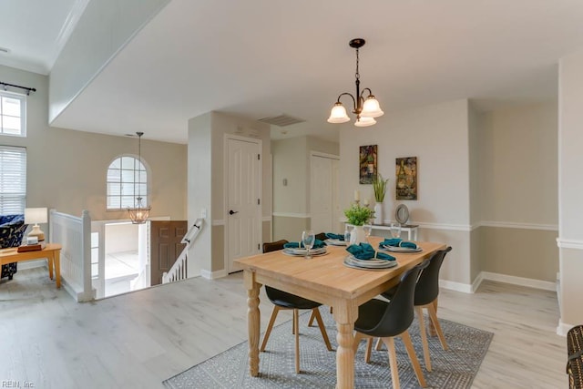 3914 Van Ness Dr, Virginia Beach, VA 23462 - dining space featuring light wood-style floors, plenty of natural light, a chandelier, and baseboards