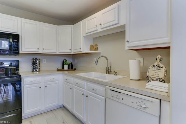 3914 Van Ness Dr, Virginia Beach, VA 23462 - kitchen with black appliances, a sink, and white cabinetry