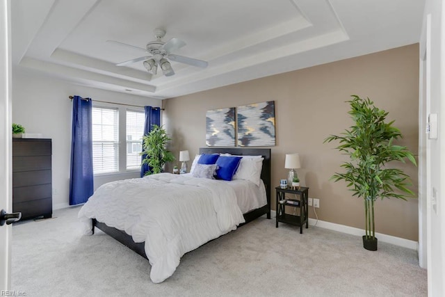 3914 Van Ness Dr, Virginia Beach, VA 23462 - bedroom featuring a tray ceiling, light colored carpet, baseboards, and ceiling fan