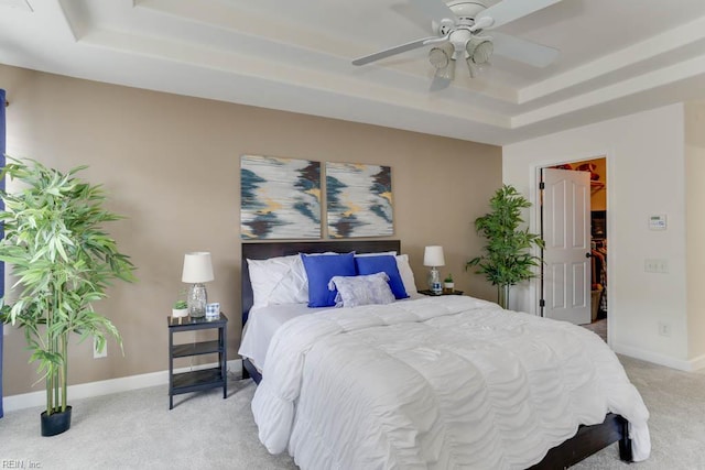3914 Van Ness Dr, Virginia Beach, VA 23462 - bedroom featuring a tray ceiling, light carpet, a spacious closet, baseboards, and a ceiling fan
